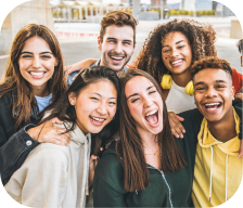 A group of friends laughing together, promoting youth wellness.